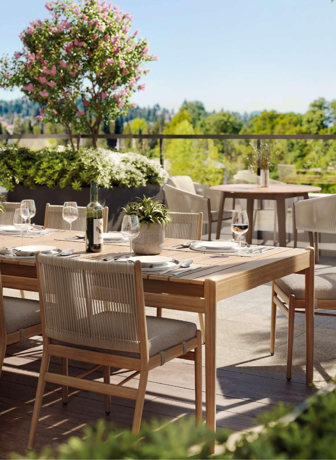 Rooftop dining terrace at Livy Port Coquitlam with greenery and outdoor seating at 2245 McAllister Avenue