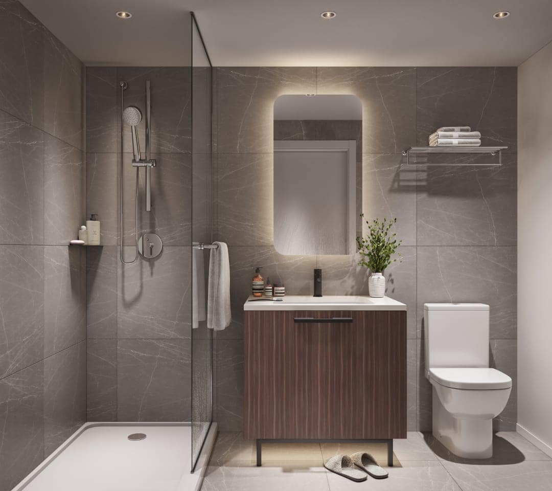 Bathroom at Frame Vancouver featuring marble-style tile walls, vanity, glass shower, and contemporary fixtures at 5189 Earles Street in Collingwood.