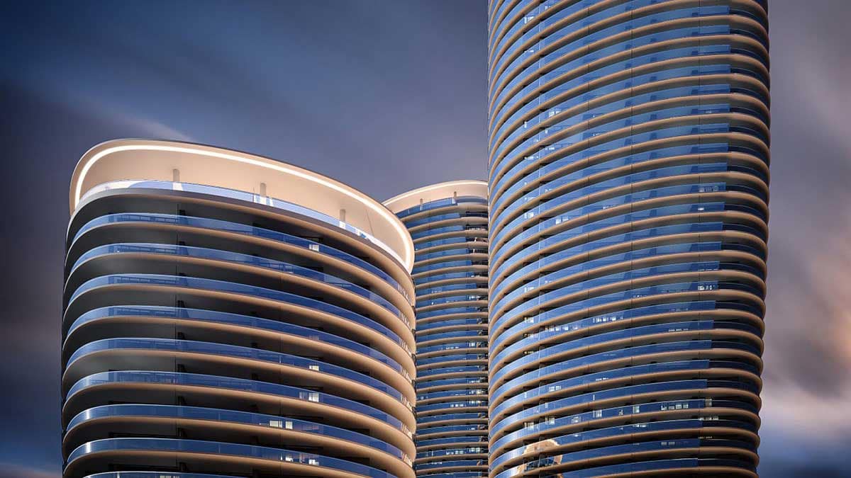 Modern high-rise condo towers in BC used for a guide on key questions to ask before buying a condo.