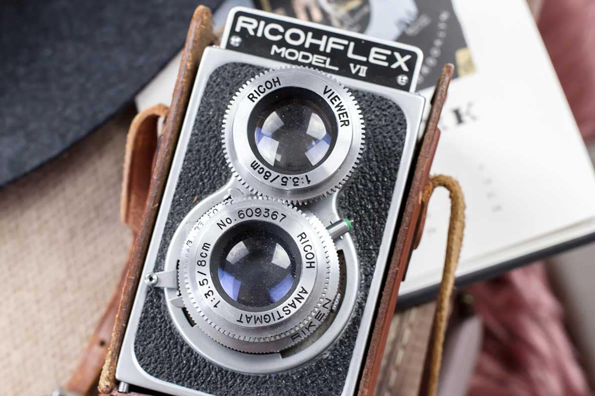 Vintage camera representing the use of professional flambient photography in high-end real estate marketing.