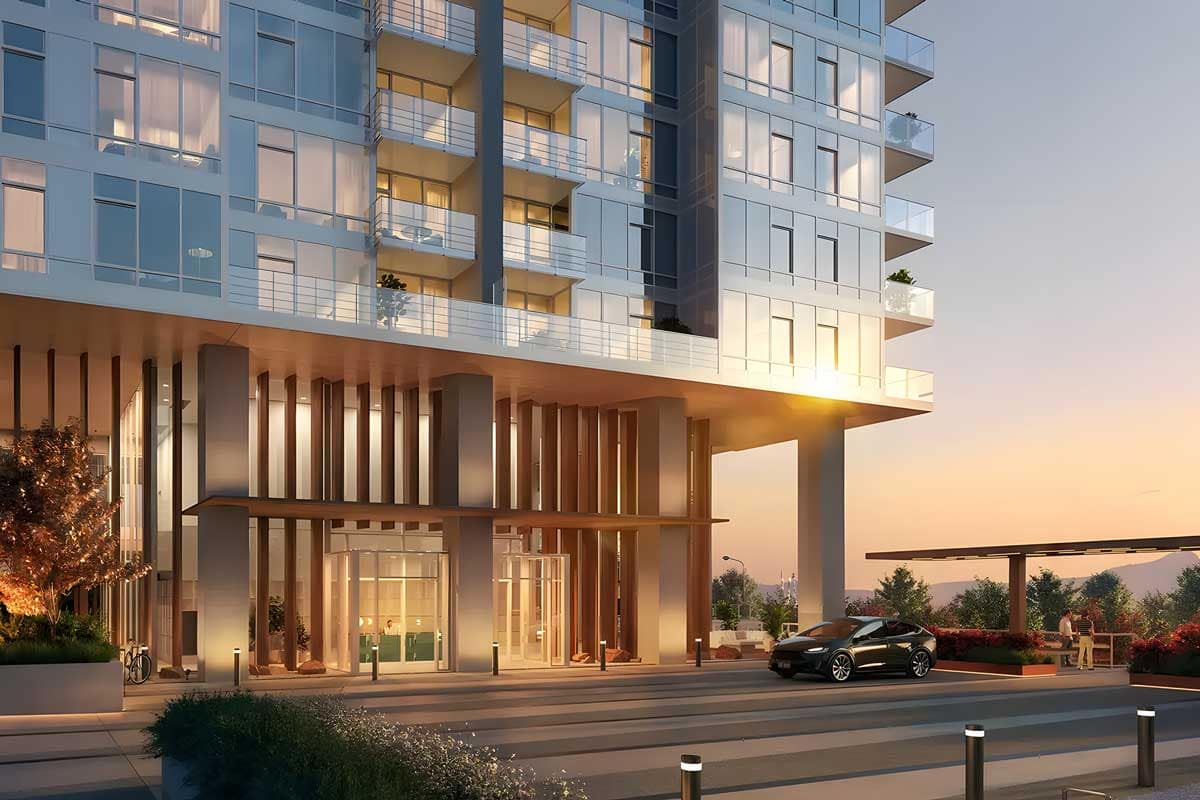 Ironwood by Qualex-Landmark Coquitlam presale condos tower entrance at sunset with modern glass façade