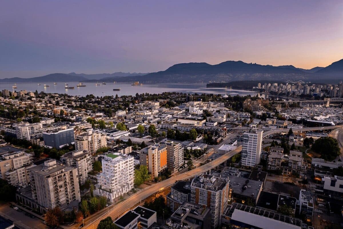 Aerial dusk view of Italia by Solterra and English Bay in Vancouver’s Fairview