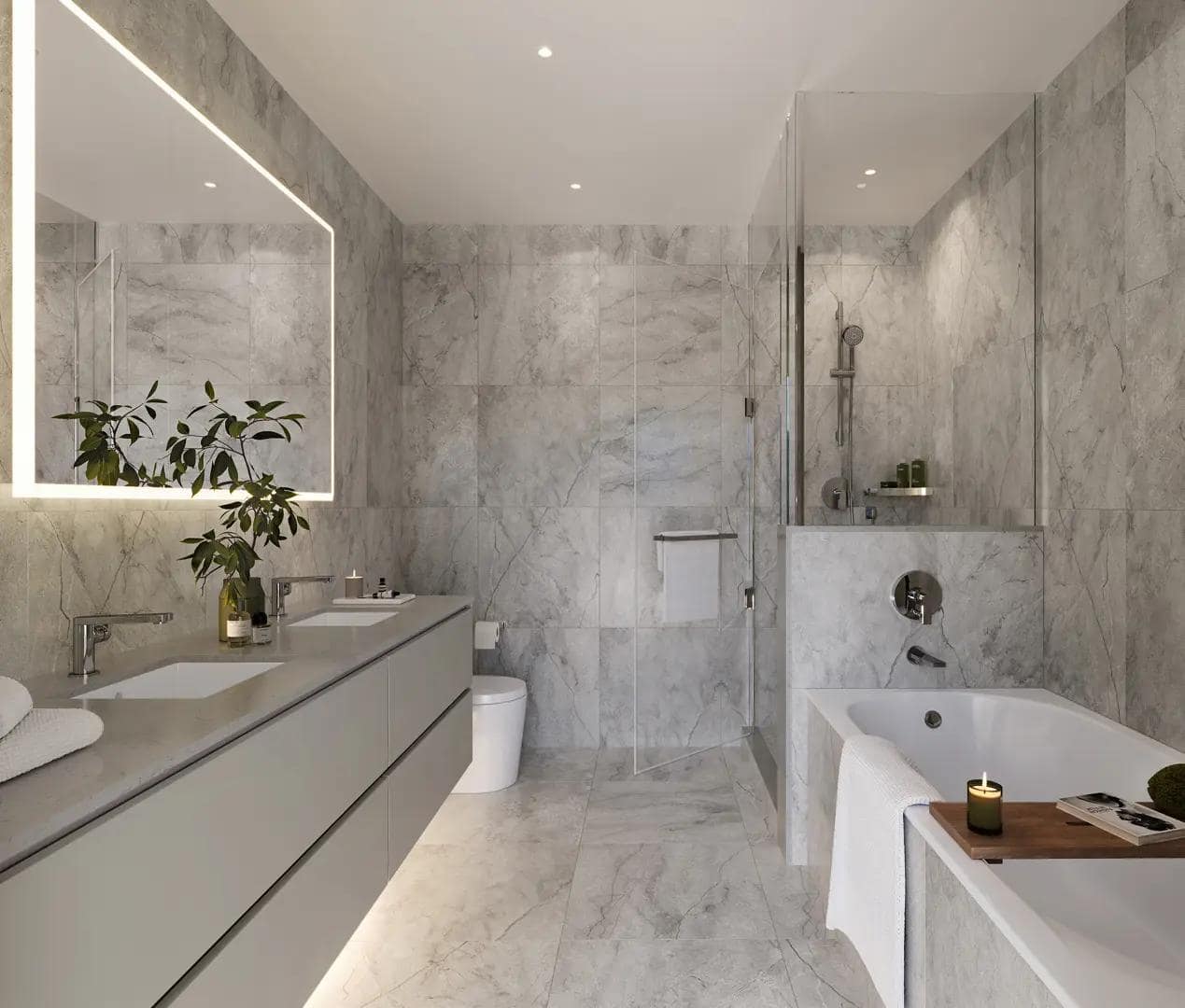 Contemporary bathroom at Arden presale in Vancouverโs Cambie neighbourhood with marble tile surrounds, deep soaking tub, glass-enclosed shower, and sleek chrome fixtures, developed by Aria Pacific Development at 4281 Cambie Street.