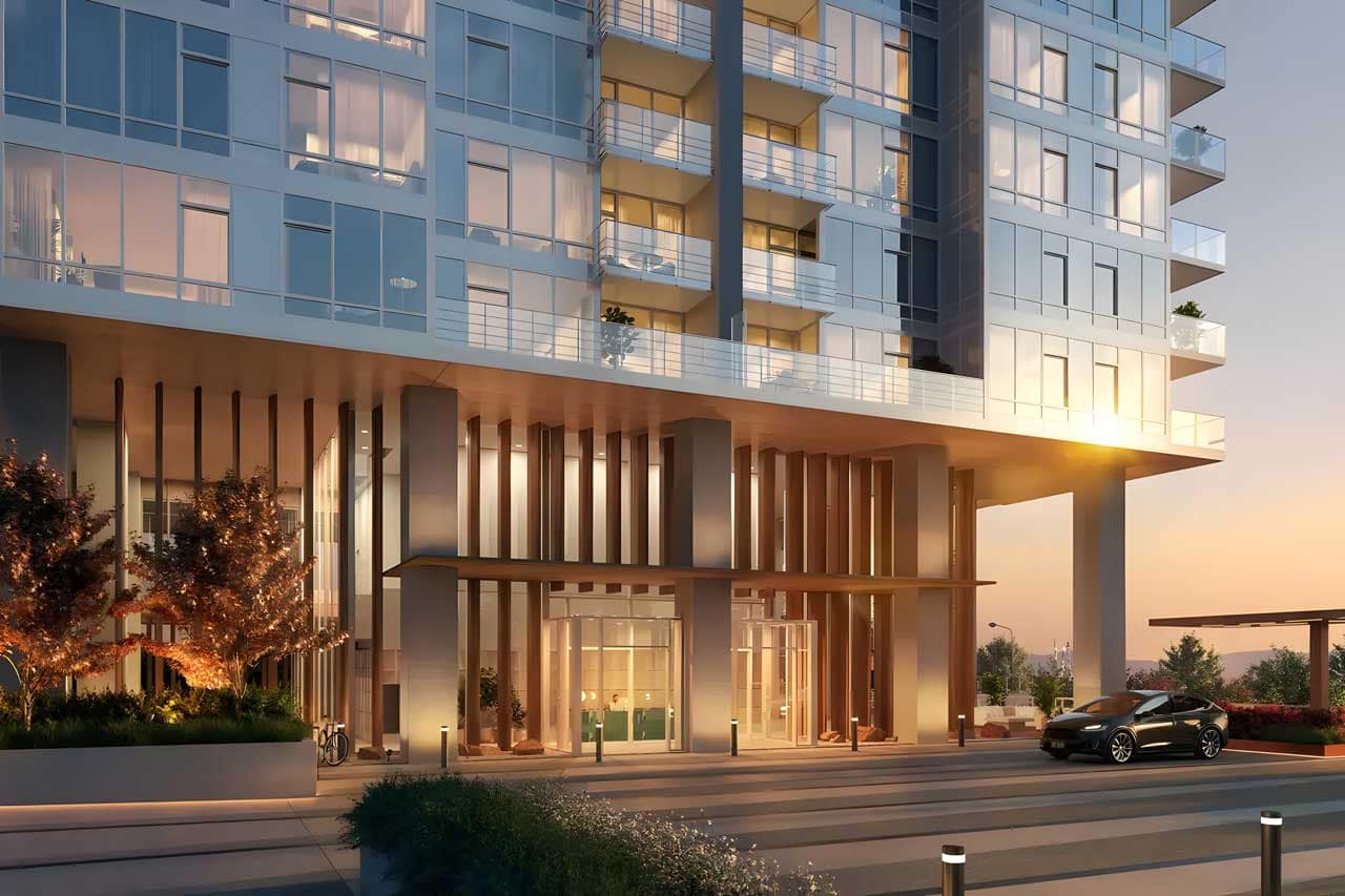 Architectural rendering of the Ironwood Coquitlam presale high-rise development by Qualex-Landmark at 617 Tyndall Street in Coquitlam, showcasing the modern tower entrance, expansive glass façade, illuminated lobby, private balconies, landscaped streetscape, and contemporary urban design at sunset in the Coquitlam West neighbourhood.