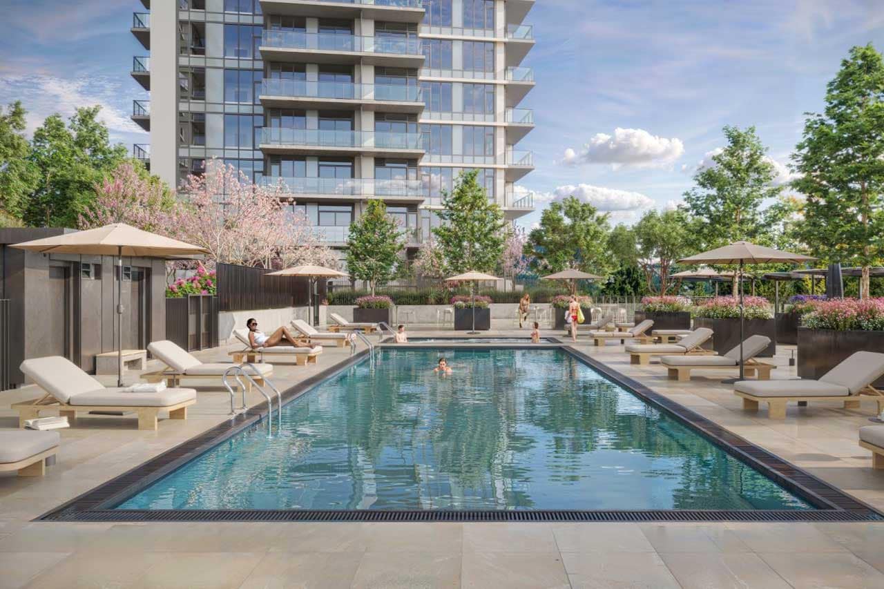 Outdoor amenity deck at Pine & Glen Coquitlam featuring a resort-style swimming pool, lounge seating, landscaped gardens, and private relaxation areas at 1175 Pinetree Way in Coquitlam.