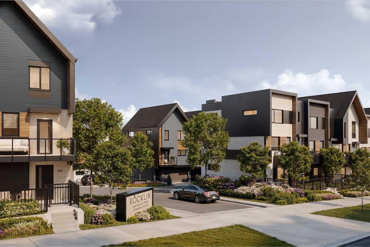 Exterior townhome rendering for Rocklin Burke Mountain in Coquitlam by StreetSide, showing modern West Coast architecture, landscaped walkways, front entries, balconies, and the community sign near 1295 Rocklin Street.