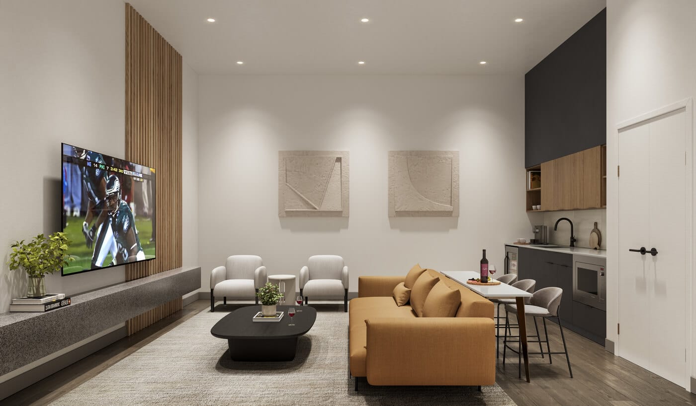Modern media lounge at Jericho Park Langley by Essence Properties featuring television seating area, kitchenette, dining space, and contemporary finishes at 19925 78B Avenue.