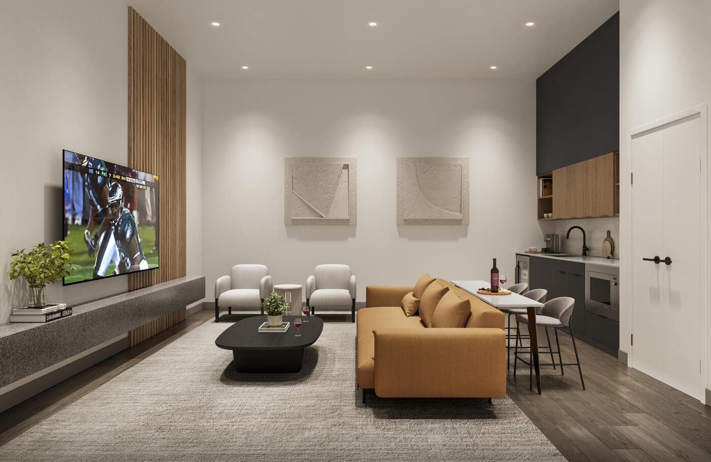 Entertainment lounge amenity at Jericho Park Langley by Essence Properties featuring contemporary seating, television area, kitchenette, dining space, and modern interior finishes at 19925 78B Avenue in Langley.