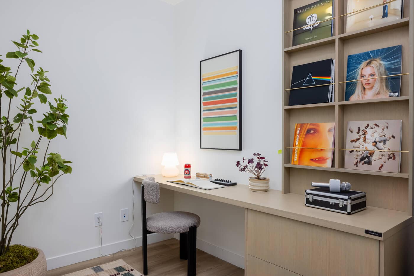 Built-in workspace and shelving area inside Jericho Park Langley condos by Essence Properties featuring integrated desk, shelving, and modern interior styling at 19925 78B Avenue.