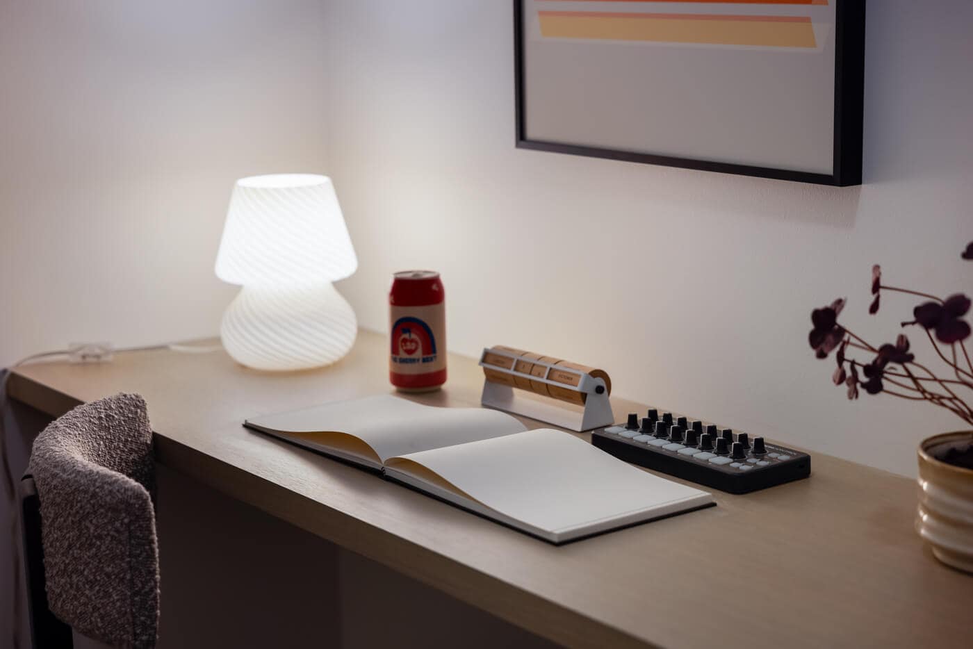 Close-up of built-in workspace at Jericho Park Langley by Essence Properties featuring desk area, shelving, decorative lighting, and modern design details at 19925 78B Avenue.