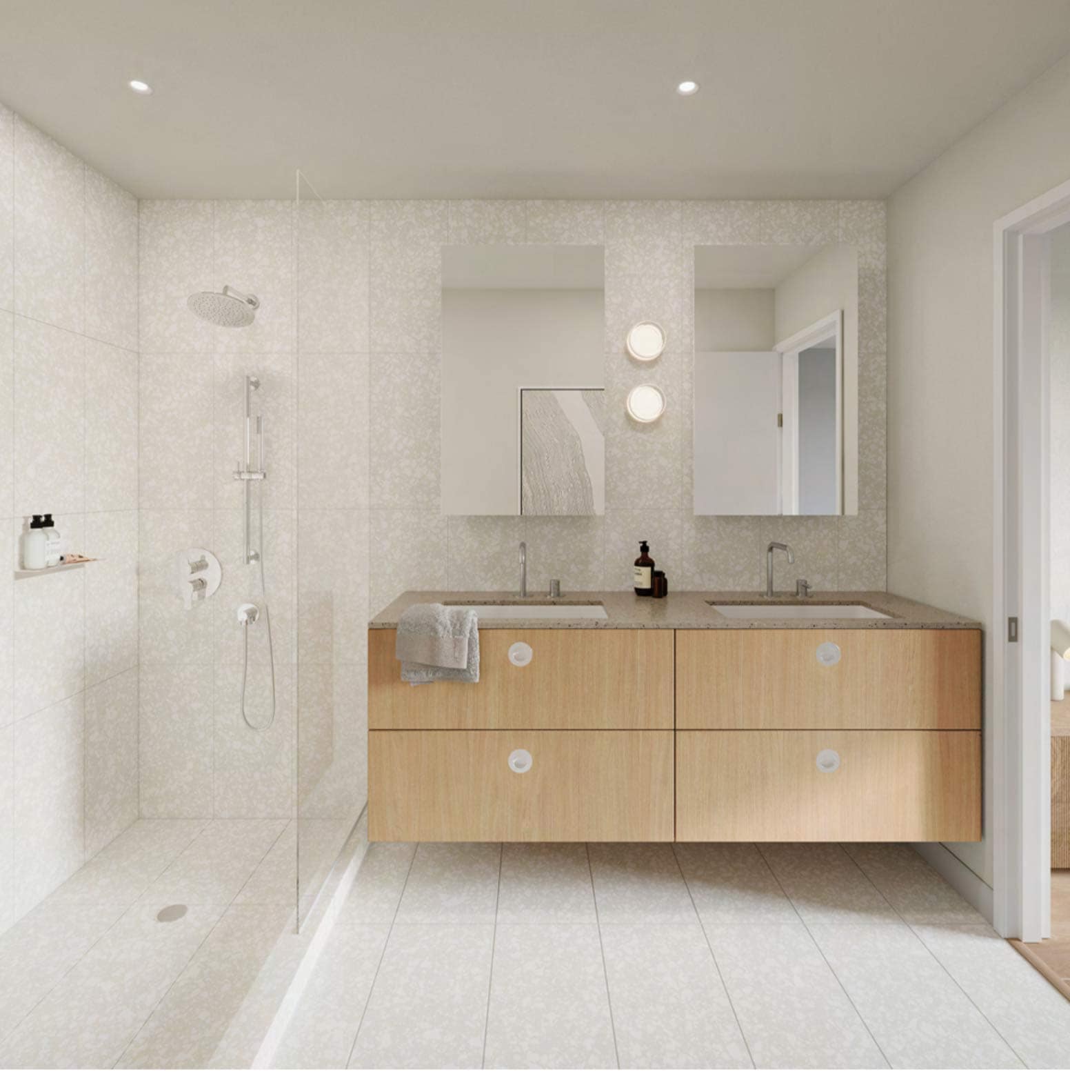 Bathroom at Hem Vancouver by Hudson with double vanity, integrated sinks, large mirrors, and walk-in shower at 385 Lakewood Drive Vancouver East