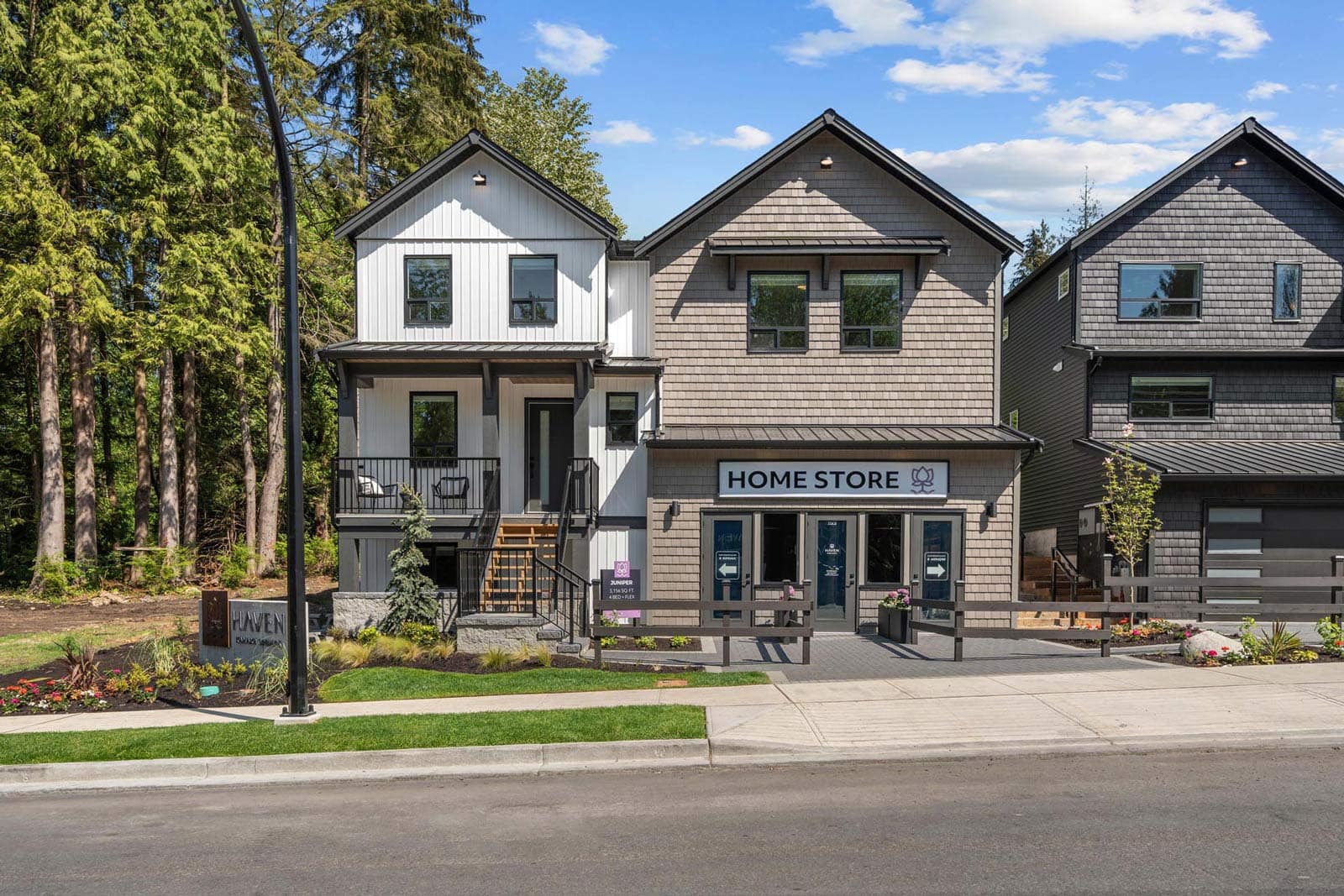 Haven Maple Ridge show home and sales centre by Epic Homes at 11205 250B Street with exterior faรงade and storefront presentation