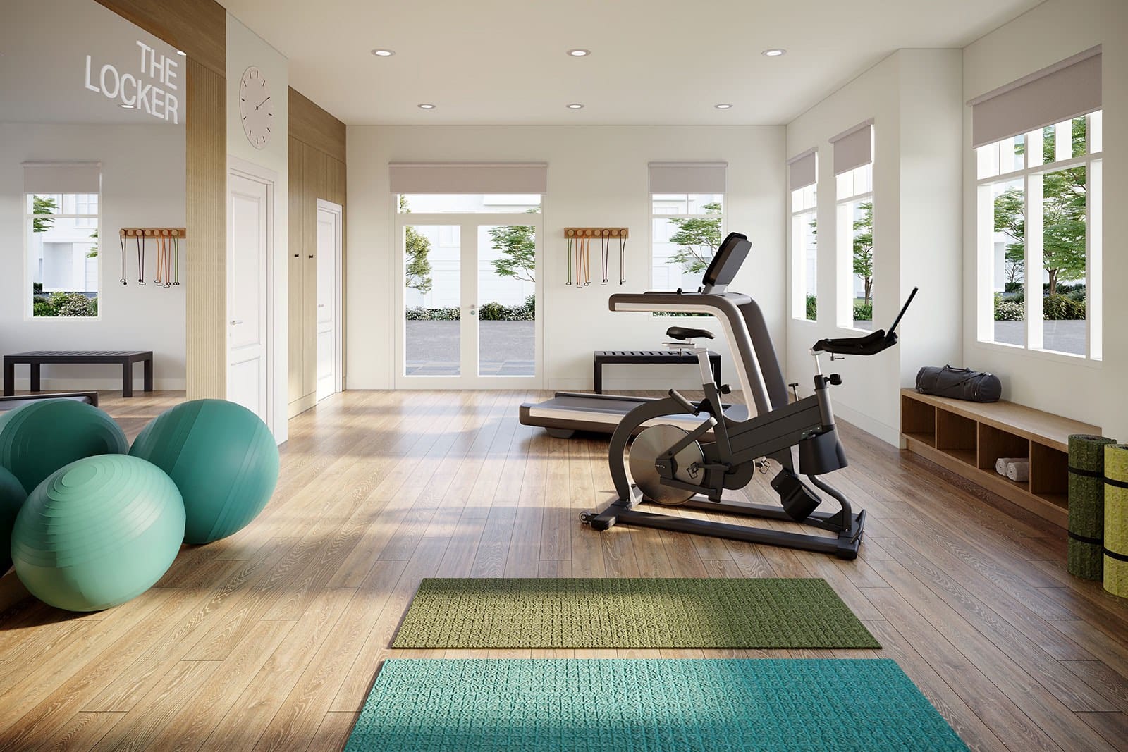 Fitness studio with exercise equipment and yoga mats at The Loop South Surrey