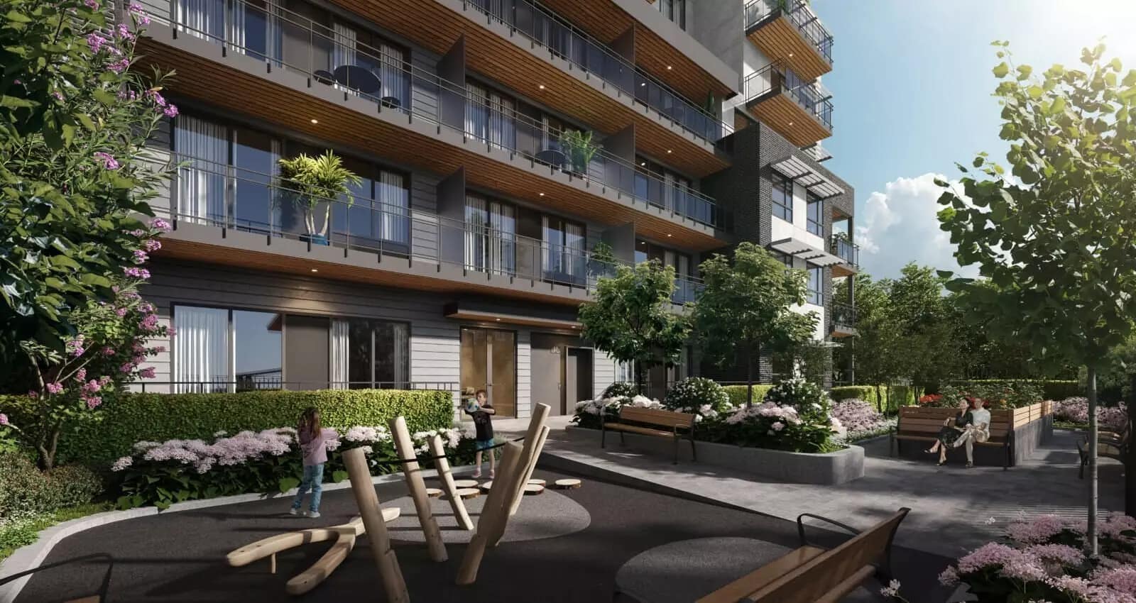 Outdoor courtyard and landscaped amenity area at Linx presale condos in East Vancouver featuring seating areas, greenery, children’s play elements, and modern residential architecture at 2268 East Broadway.