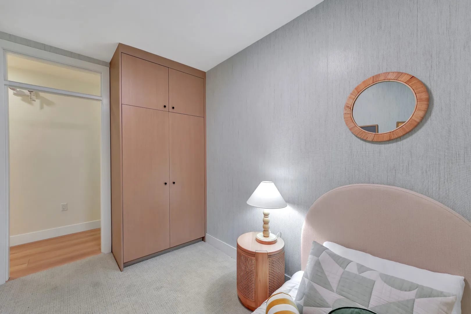 Bedroom at Jethro Langley featuring built-in closet, soft lighting, and modern finishes in a Langley City presale condo by Whitetail Homes