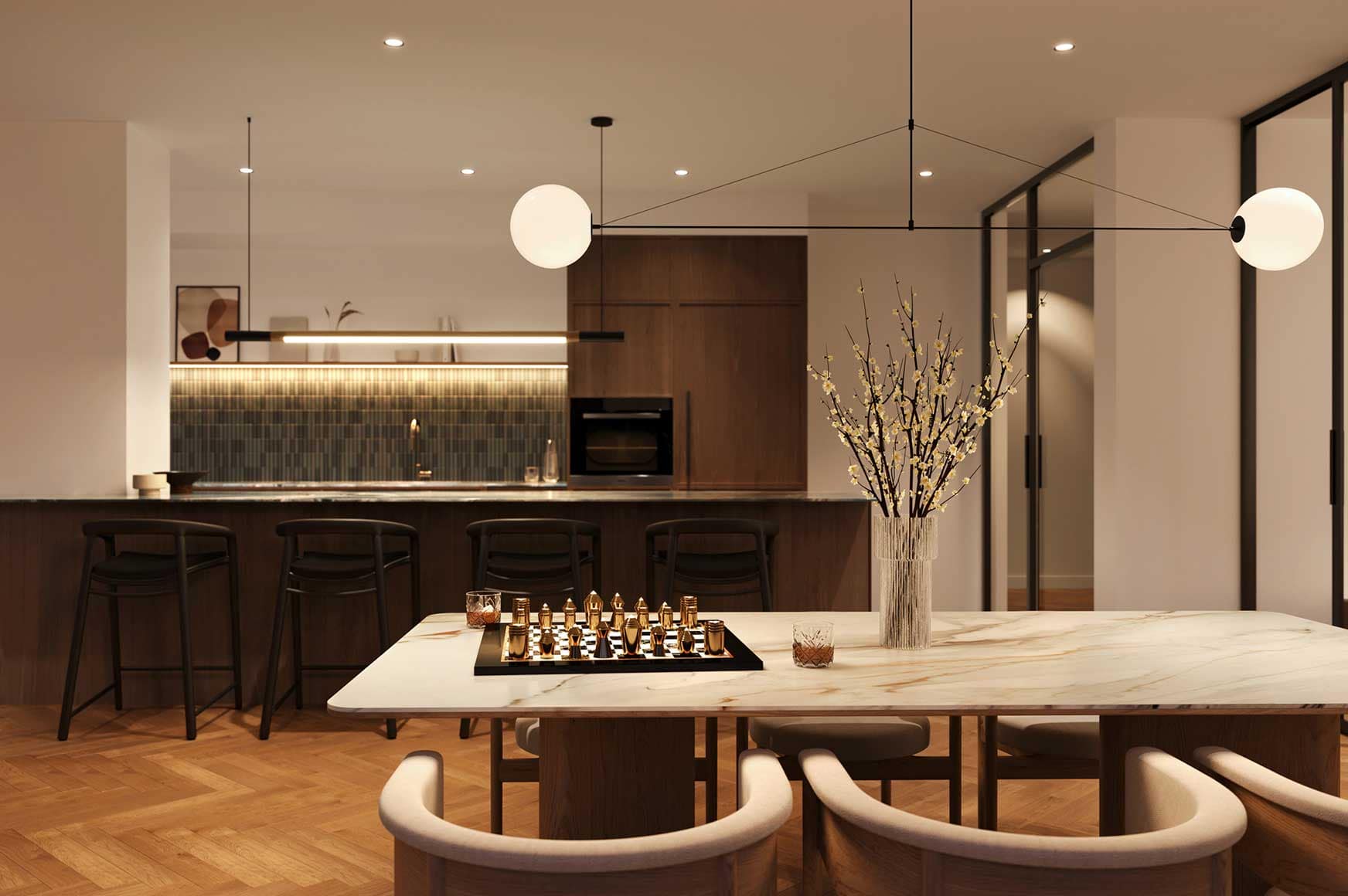 Elegant entertainment kitchen and dining area at Encore Coquitlam featuring premium finishes, modern lighting, large dining tables, and gathering spaces for residents at Fraser Mills.