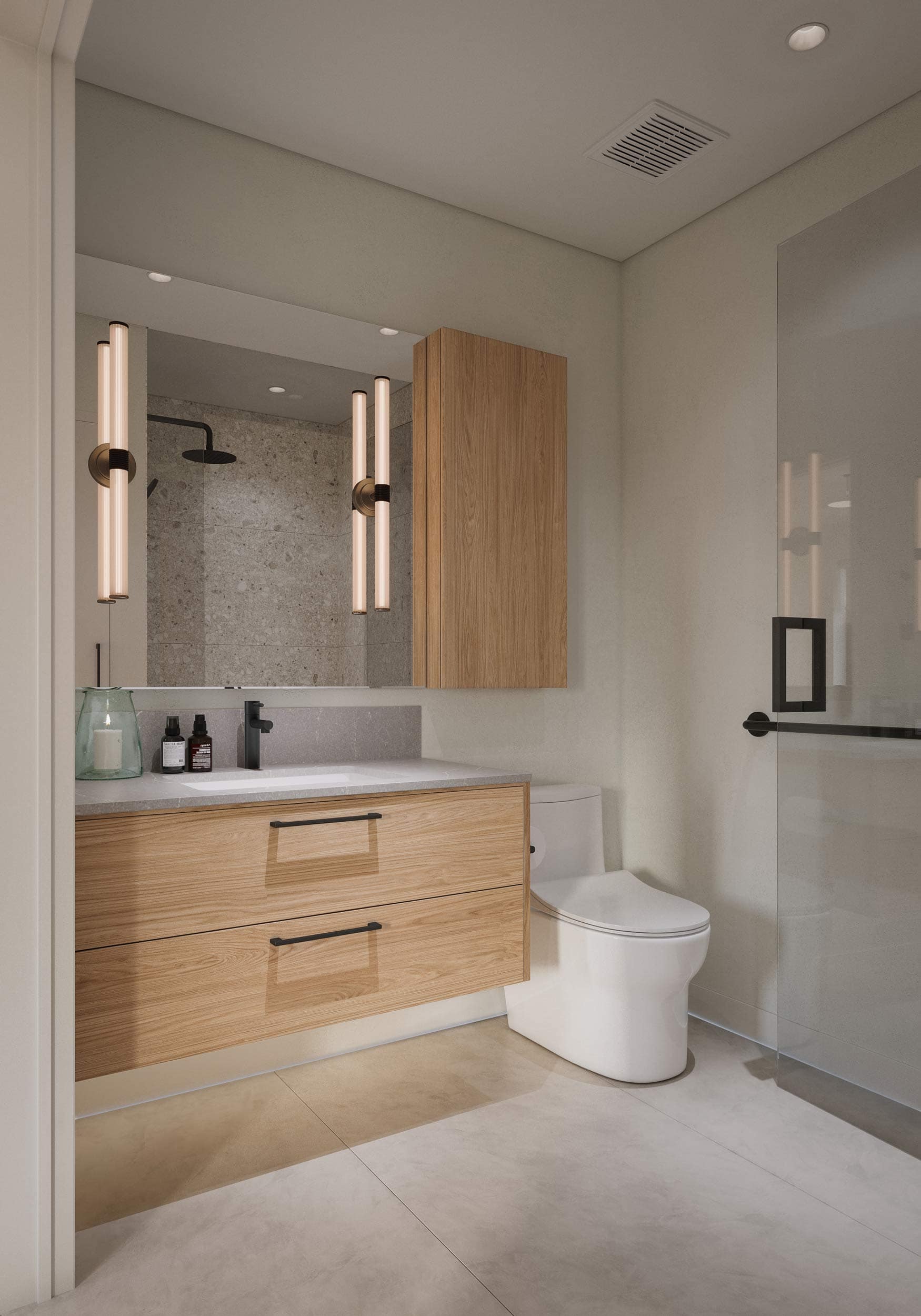 Spa-inspired bathroom at Quintet Vancouver East featuring a floating wood vanity, integrated storage drawers, modern wall-mounted lighting, and refined finishes by THT Properties at 2240 East 40th Avenue in Vancouver.