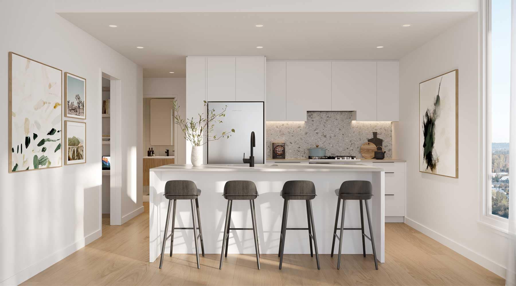 Bright kitchen interior at Encore Coquitlam showcasing a large island, quartz-style surfaces, modern cabinetry, and open-concept design within the Fraser Mills community.
