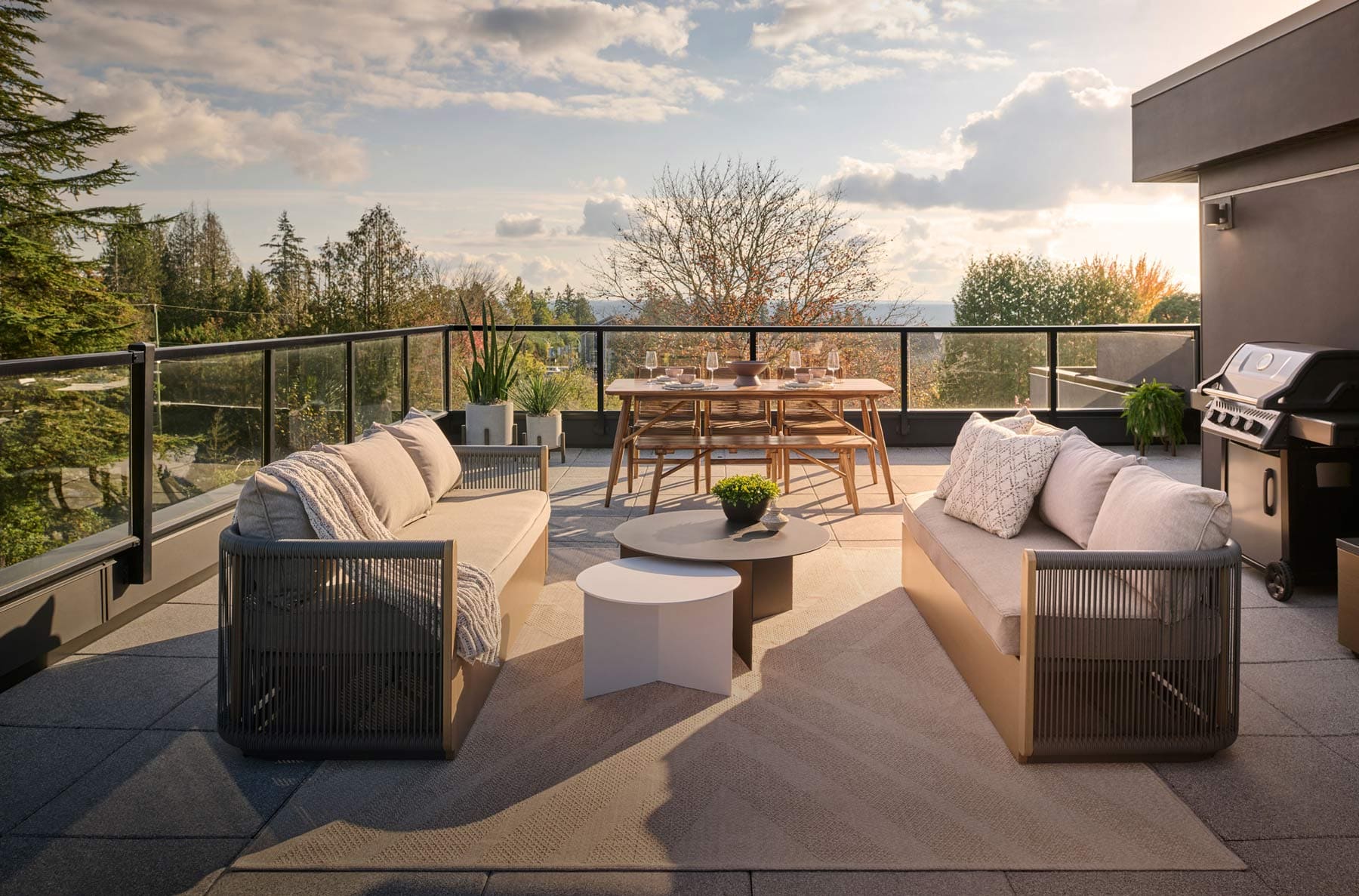 Private rooftop terrace at Addition Langley in Langley’s Willoughby featuring outdoor seating, BBQ area, dining table, and open views by Redekop Ferrario Properties