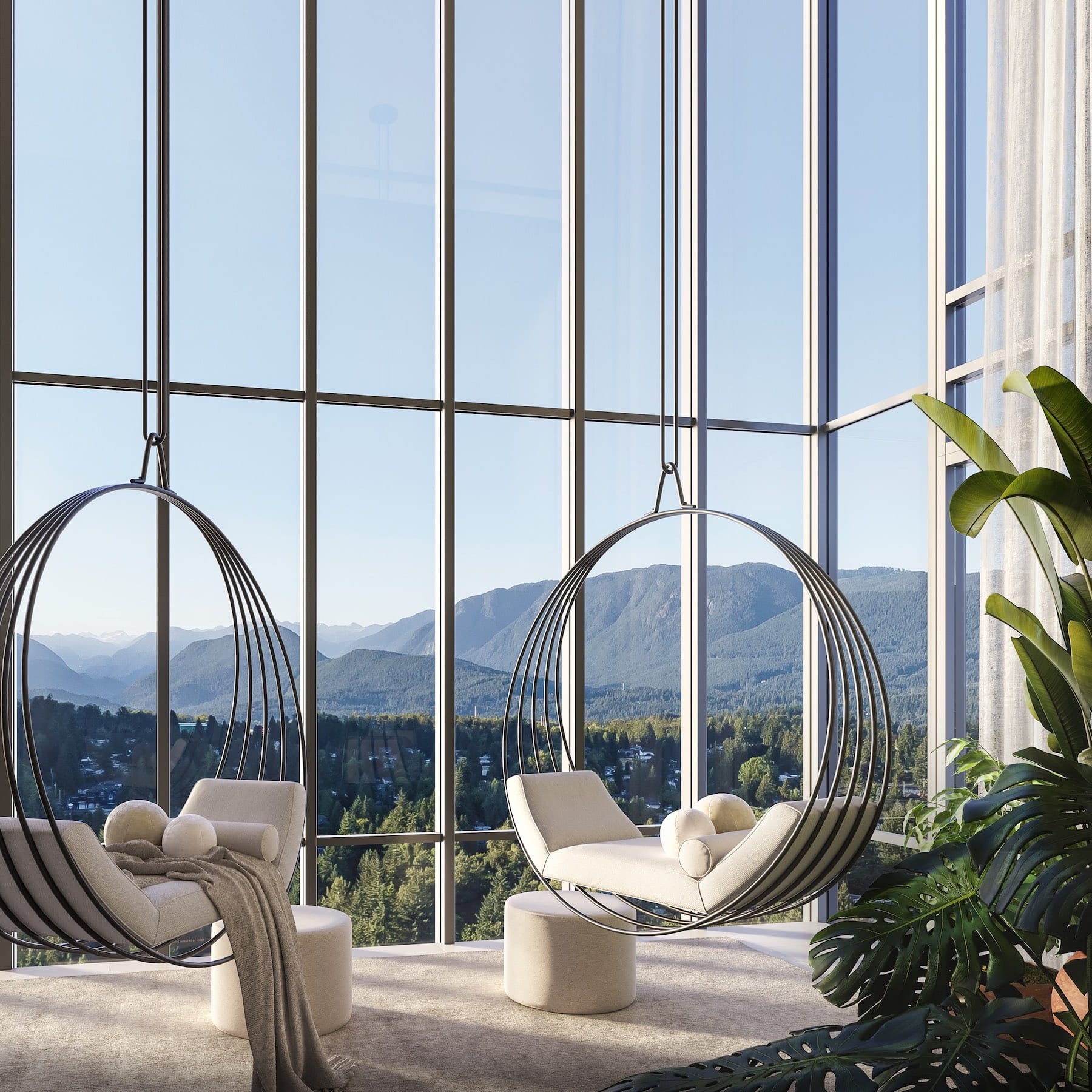 Ironwood Coquitlam lounge with hanging chairs overlooking mountain views