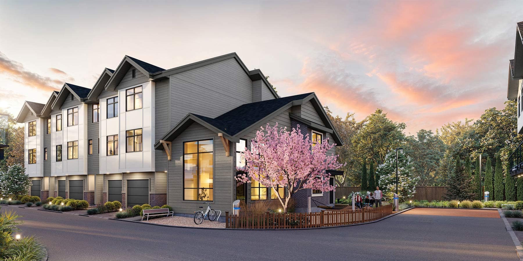 Street-level view of Charlton Cloverdale townhomes at 17429 59 Avenue, developed by Warwickshire Homes, showing modern farmhouse-style exteriors, attached garages, landscaped sidewalks, and a quiet residential setting in Cloverdale.