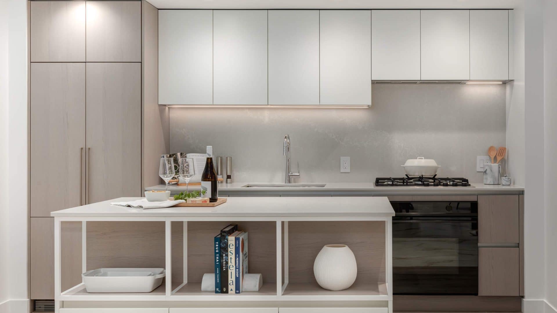 Contemporary kitchen with island and integrated appliances at Artesia Metrotown Burnaby