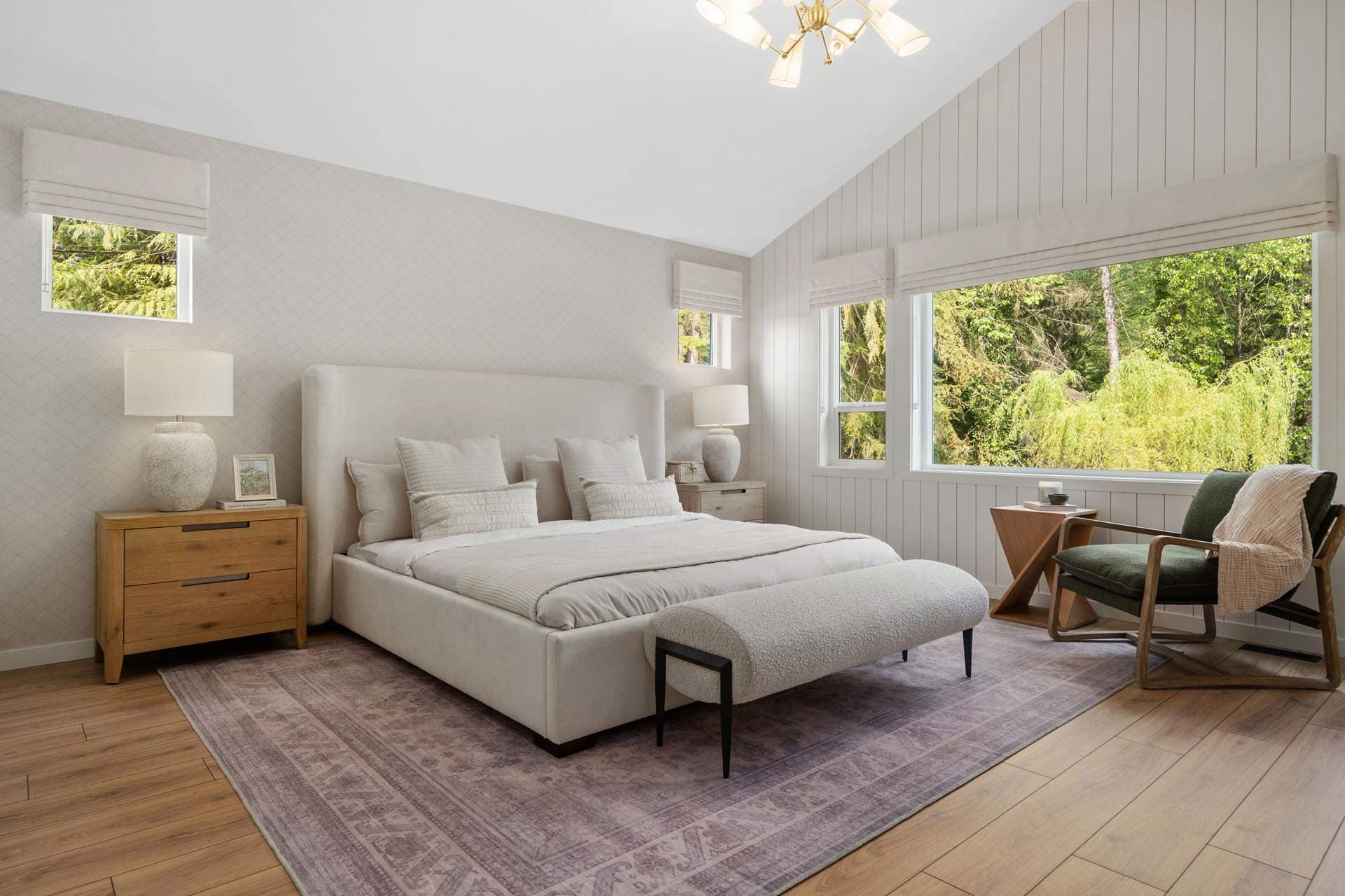 Primary bedroom at Haven Maple Ridge by Epic Homes at 11205 250B Street with vaulted ceiling, large windows, and neutral decor