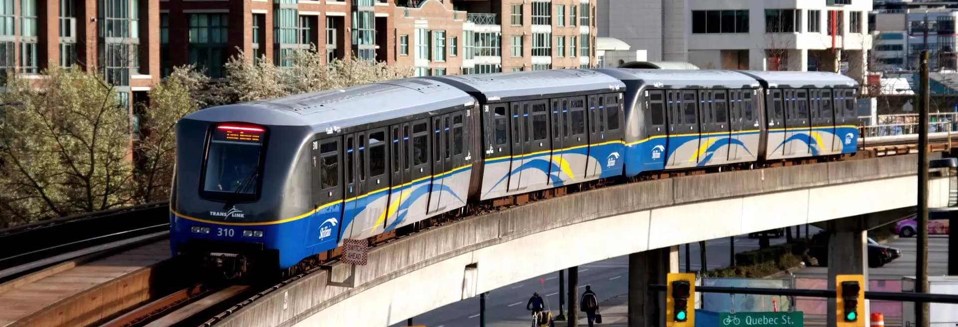 Vancouver SkyTrain traveling near Commercial-Broadway Station, showcasing the transit connectivity available to residents of Linx at 2268 East Broadway in East Vancouver.
