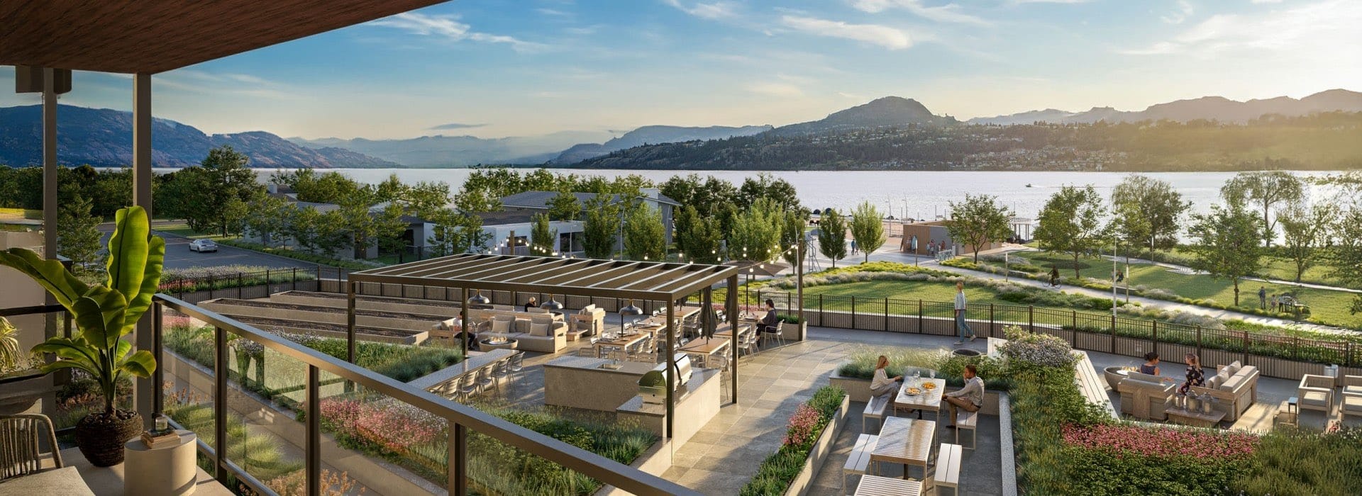 Amenity terrace at Alma Kelowna with lounge areas, BBQ spaces and direct views of Okanagan Lake.