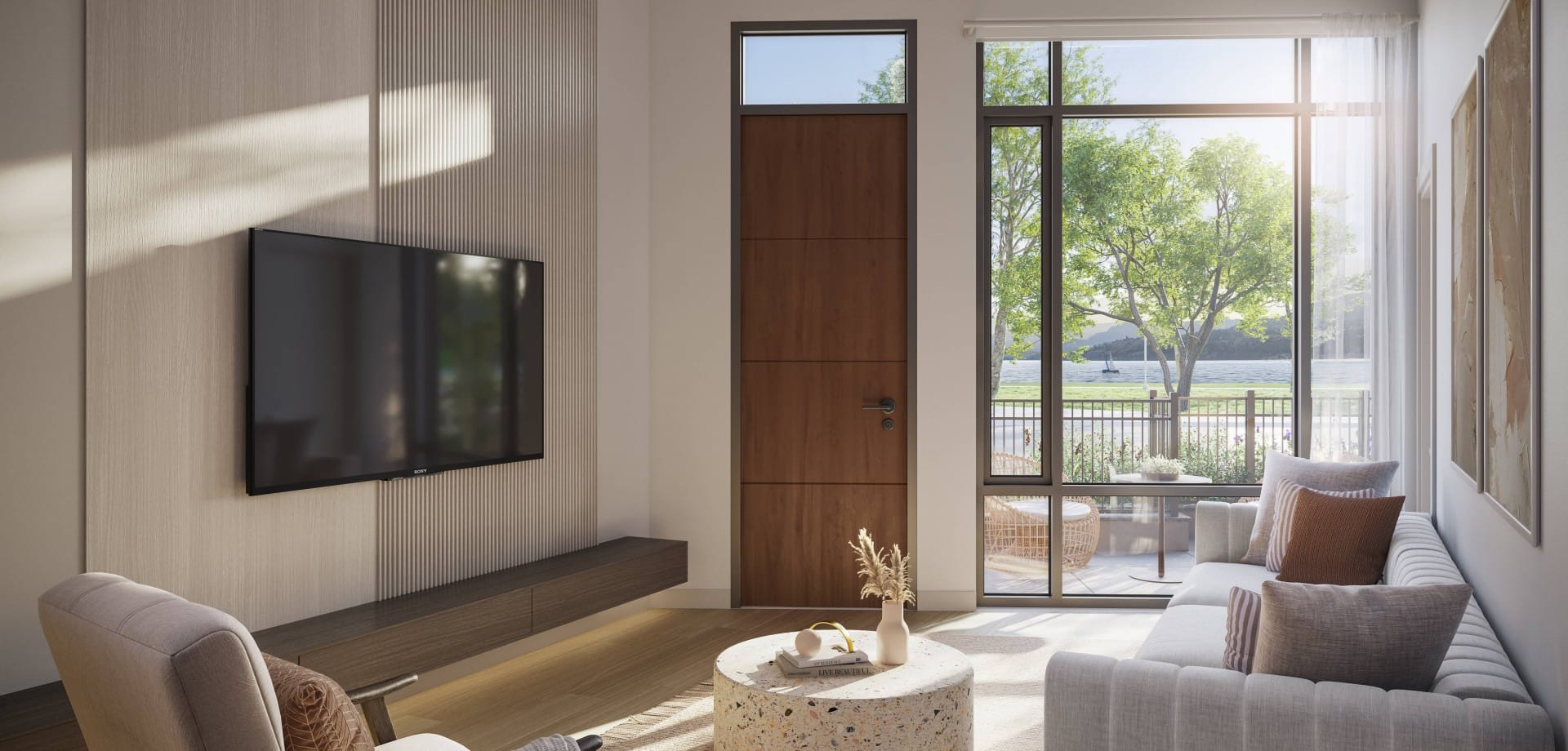 Interior living room at Alma Kelowna showing large windows, lake views, and direct access to Pandosy Waterfront Park.