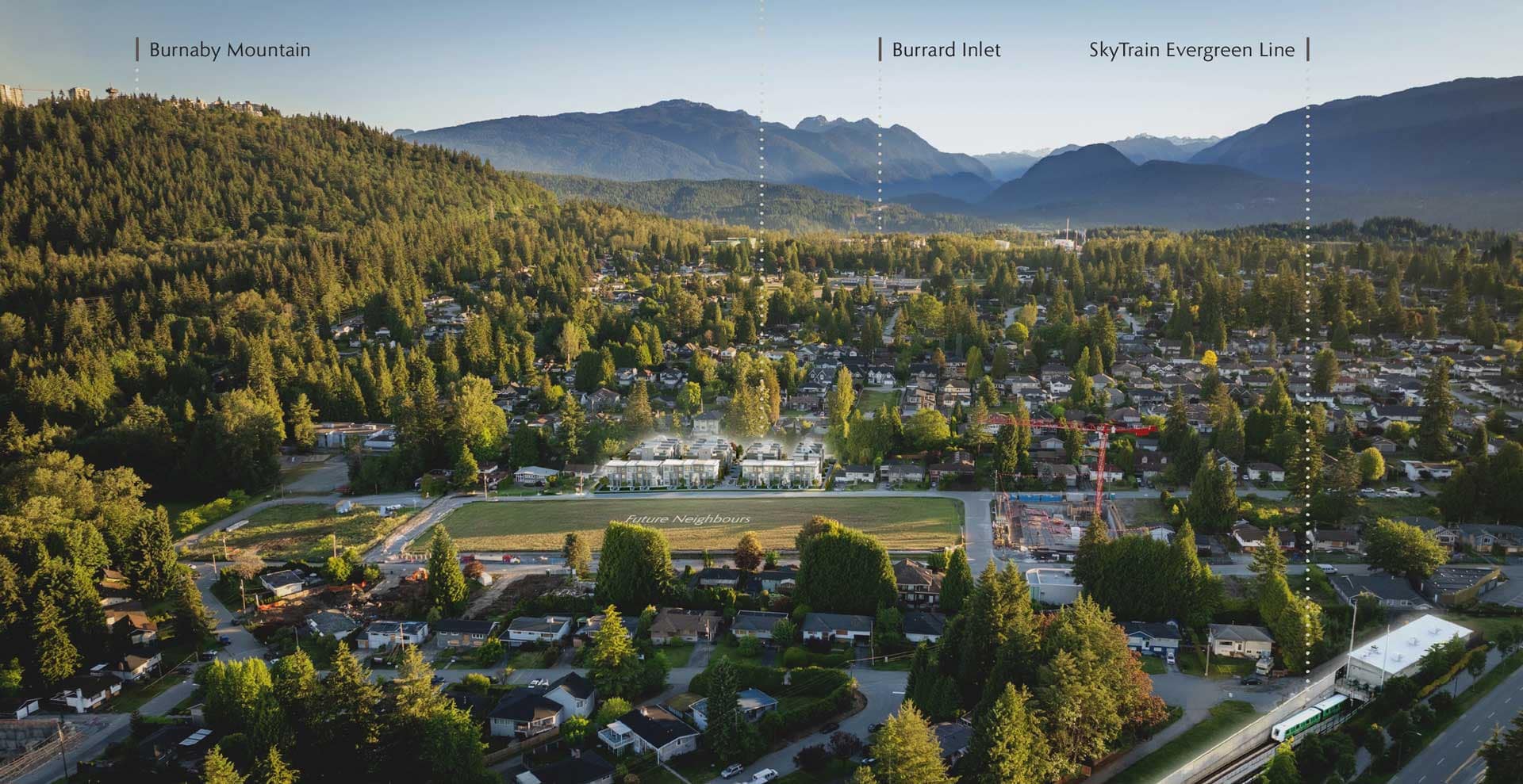 Aerial view of Harriswood Coquitlam presale townhome development by Domus Homes at 611 Harrison Avenue in Coquitlam West, showing surrounding residential neighbourhood, proximity to Burnaby Mountain, Burrard Inlet, Evergreen SkyTrain Line, and nearby green spaces with mountain backdrop