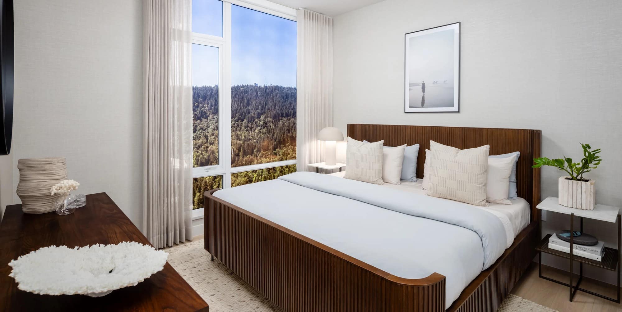 Bedroom with large window and forest views at Ironwood Coquitlam presale condos.