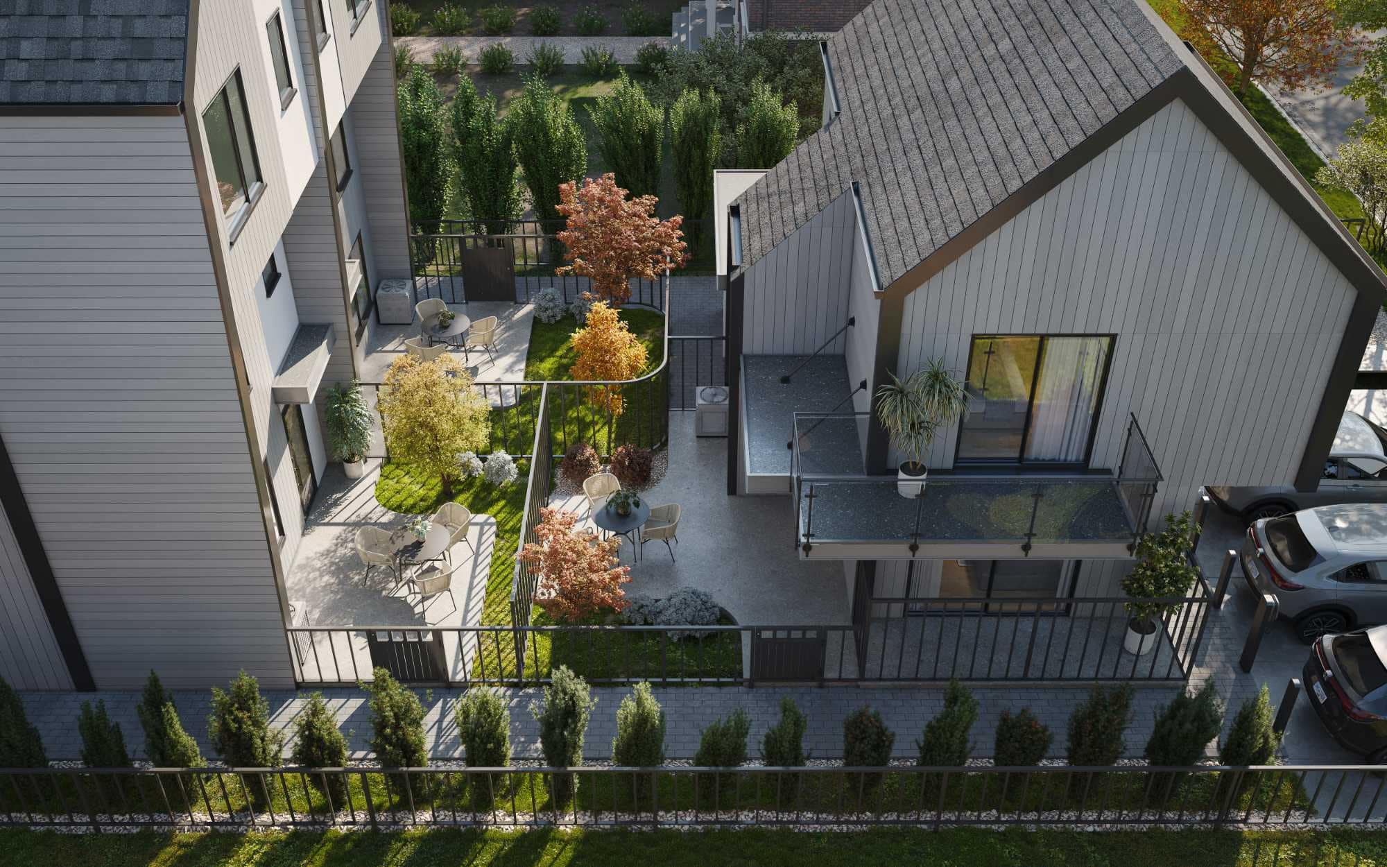 Aerial view of Quintet Vancouver East landscaped courtyard featuring private patios, green space, outdoor seating areas, and townhome entrances designed by THT Properties.