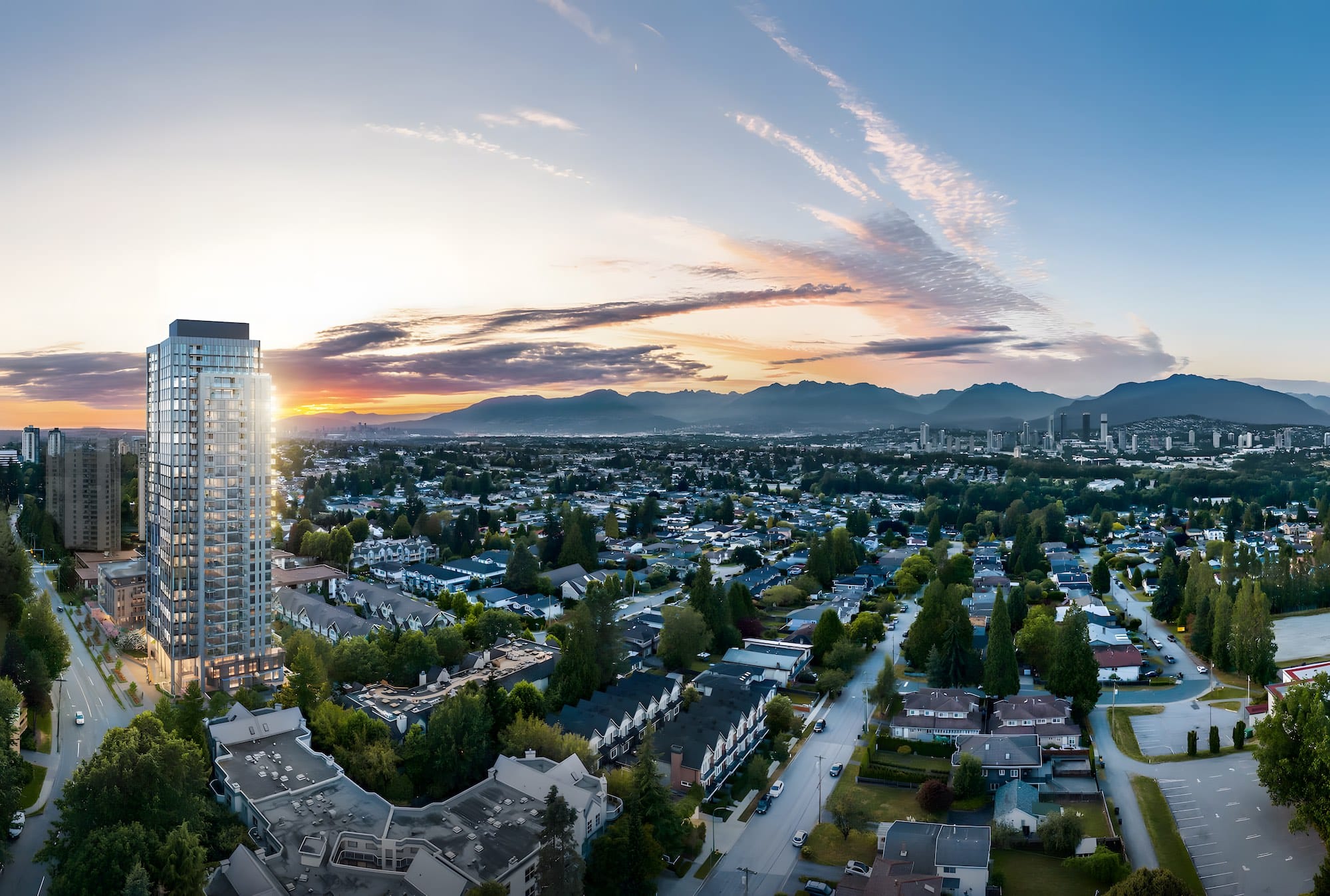Aerial view of Artesia Metrotown tower in Burnaby with skyline and mountain backdrop.