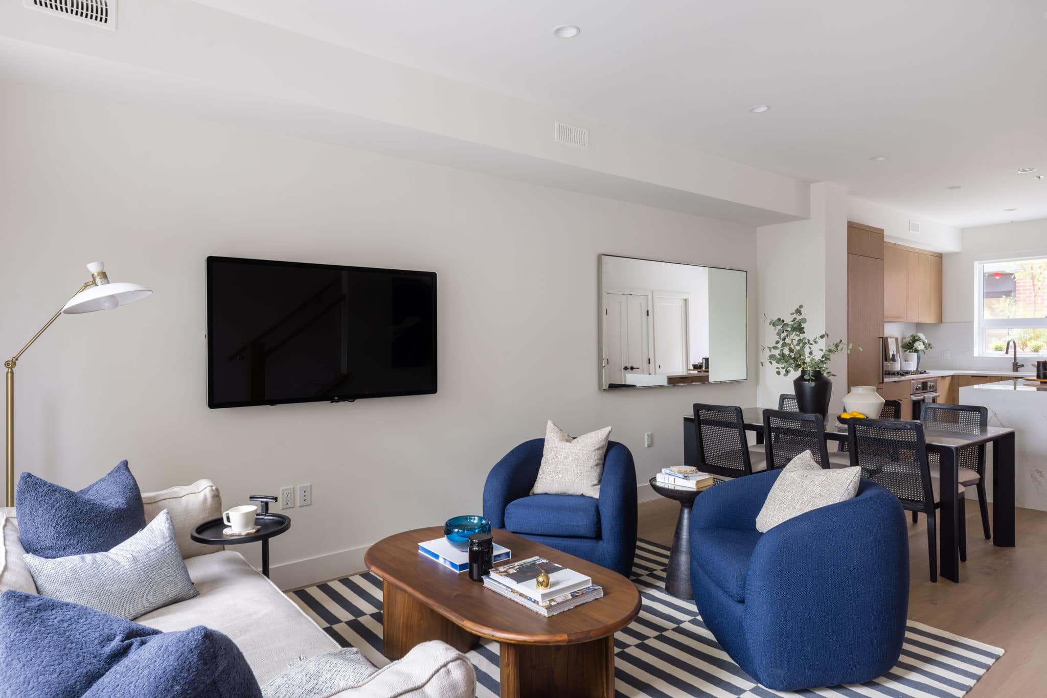 Modern living room inside York Vancouver townhomes by Listrator at 802 West 37th Avenue in Vancouver’s Cambie Corridor, featuring contemporary furnishings, open-concept design, and seamless connection to the kitchen and dining area.