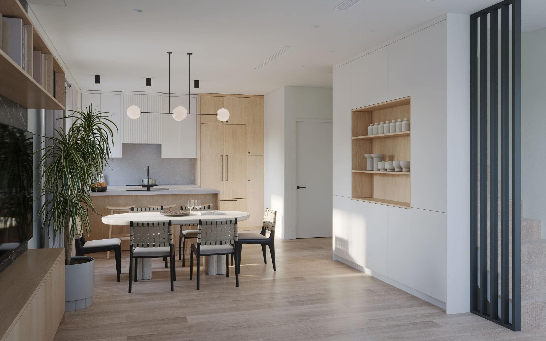 Open-concept living, dining, and kitchen area at Quintet Vancouver East featuring custom millwork, wood cabinetry, integrated shelving, modern lighting, and refined finishes by THT Properties at 2240 East 40th Avenue.