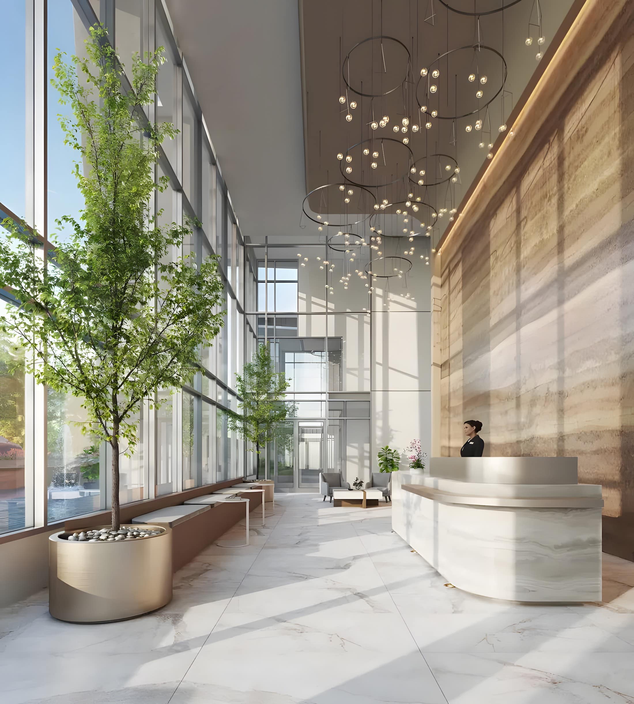 Double-height lobby at Artesia Metrotown Burnaby with modern lighting and marble finishes.