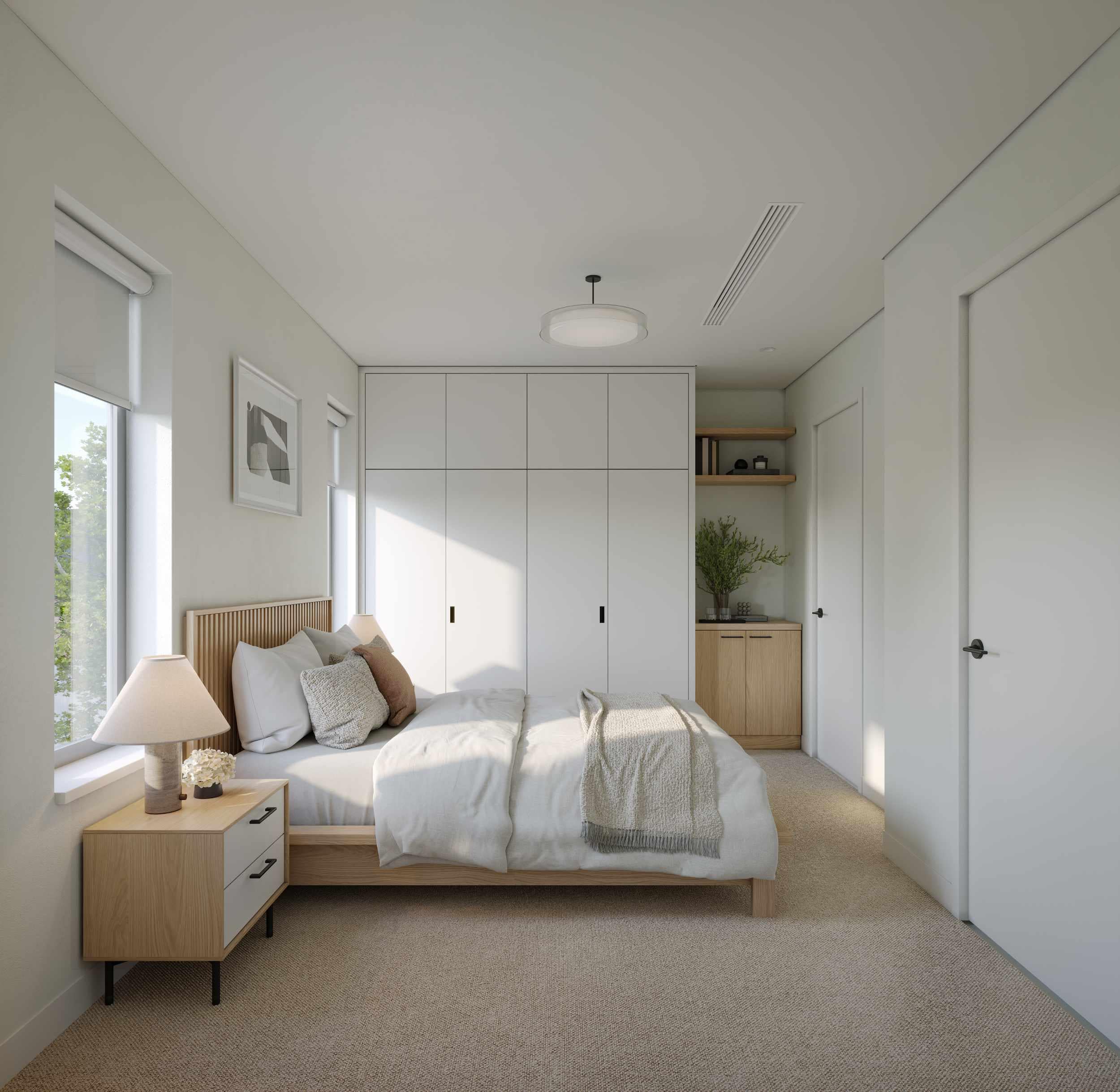 Bedroom interior at Quintet Vancouver East with custom built-in closets, soft carpeting, minimalist lighting, and efficient layout designed by THT Properties.