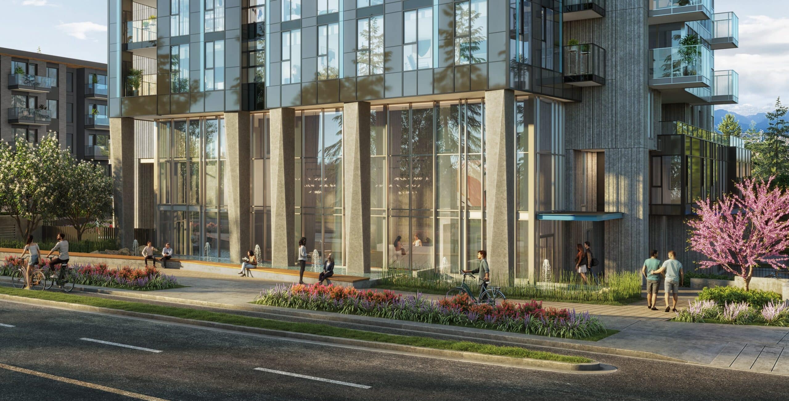 Artesia Burnaby tower street-level view with landscaped walkway and glass faรงade