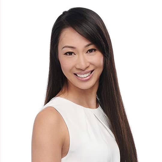 Portrait of Anna Yeung, CIBC Mobile Mortgage Advisor, smiling confidently in professional attire.