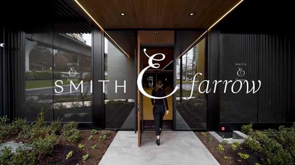 Main entrance at Smith & Farrow presale development in Coquitlam West by Boffo Developments, located at 720 Farrow Street, featuring the signature Smith & Farrow branding, contemporary façade, landscaped entryway, and refined architectural detailing captured for the project video thumbnail.