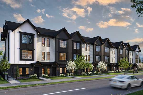 Bromley Langley presale townhomes streetscape in Brookswood by Leone Homes at 20815 45A Avenue featuring a row of modern farmhouse-style homes with black and white siding, pitched roofs, landscaped walkways, blooming trees, and a residential street view in Langley.