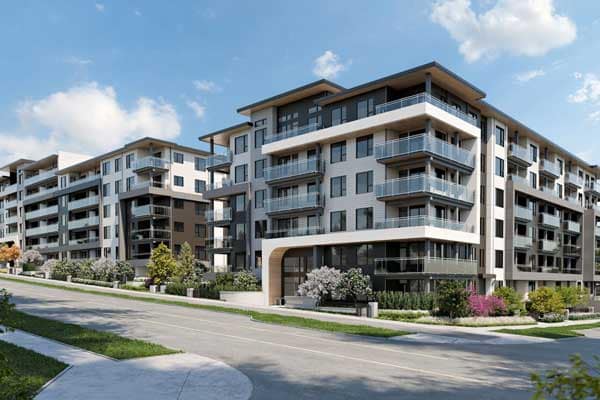Front-facing exterior rendering of Goldfinch presale development by Polygon at 628 Smith Avenue in Coquitlam West, showing contemporary low-rise residential buildings with glass balconies, modern cladding, landscaped frontage, and a quiet tree-lined street.