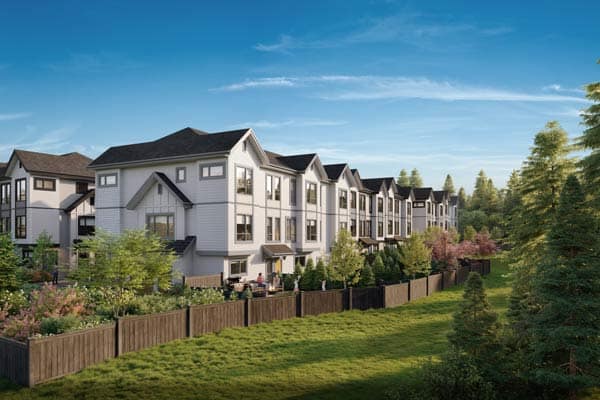 Wide streetscape view of Nature Haus Fleetwood townhomes showing landscaped community, modern architecture, and green surroundings at 16487 89 Avenue Surrey by Isle of Mann Property Group