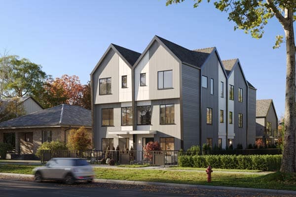 Front elevation of Quintet Vancouver East townhomes at 2240 East 40th Avenue, showcasing modern West Coast architecture, pitched rooflines, landscaped frontage, and a boutique residential setting by THT Properties.