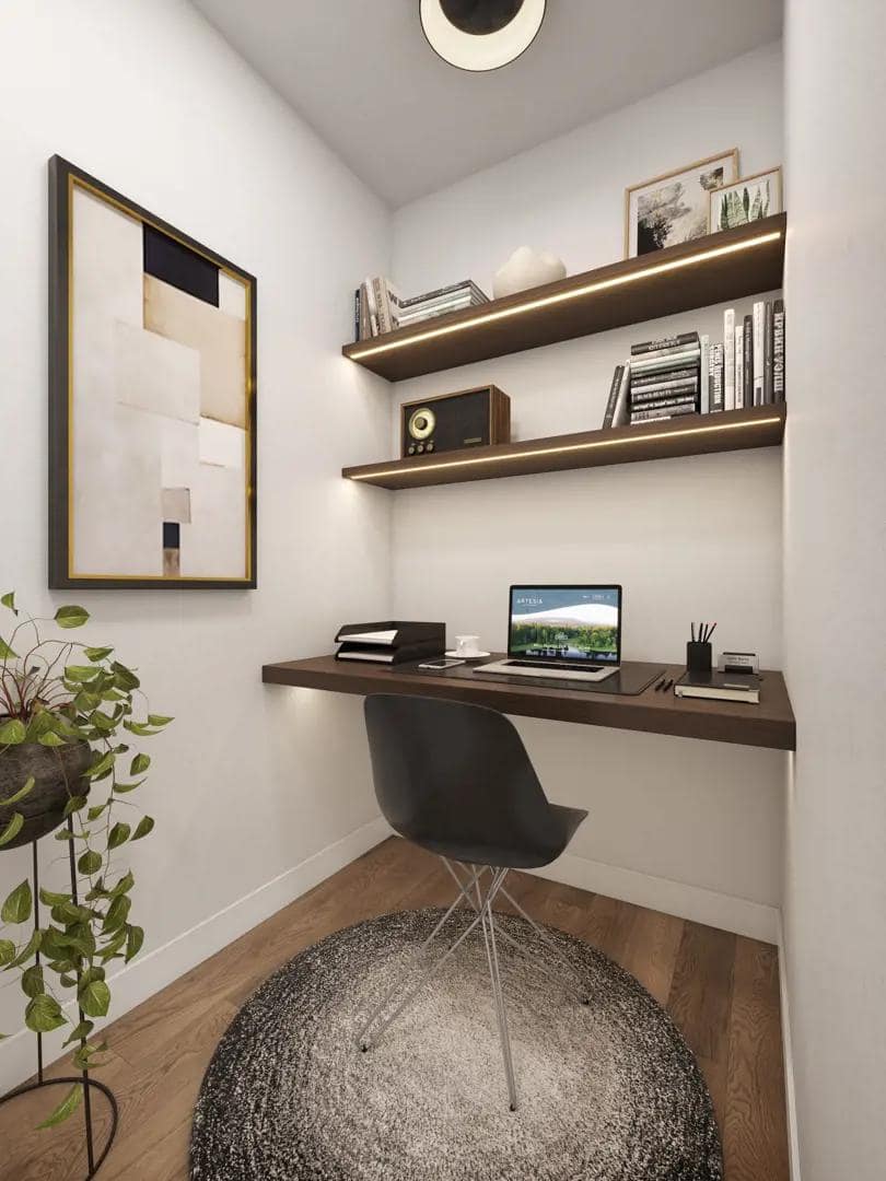 Compact home office nook at Artesia Burnaby with floating desk and open shelving.