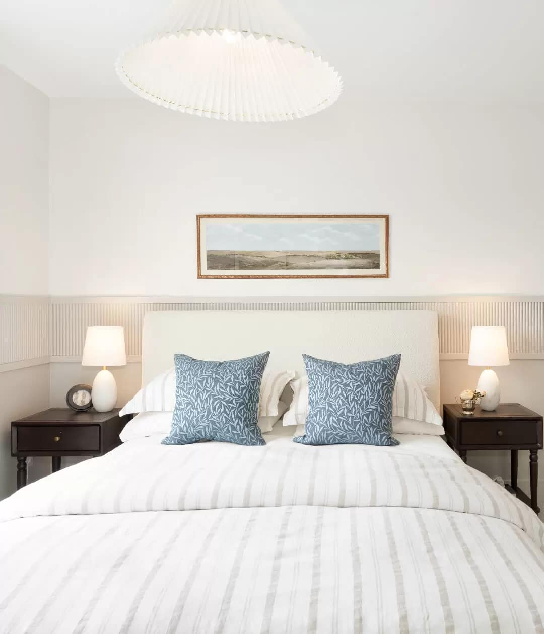 Cozy bedroom interior at Renfrew South Langley presale development in Willoughby Langley by CastleHill Homes at 20329 80 Avenue