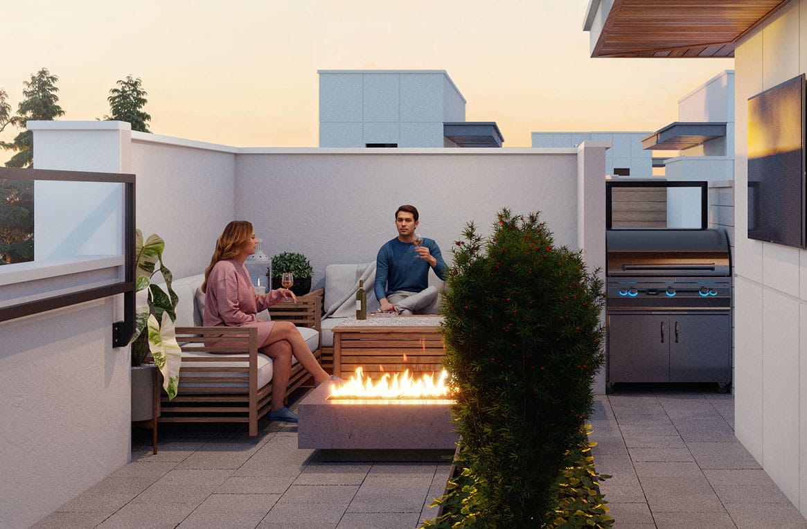 Residents enjoying rooftop entertaining terrace at Park Avenue Langley townhomes by Apcon Group with fire feature, lounge seating, and outdoor barbecue at 7946 204 Street in Langley.