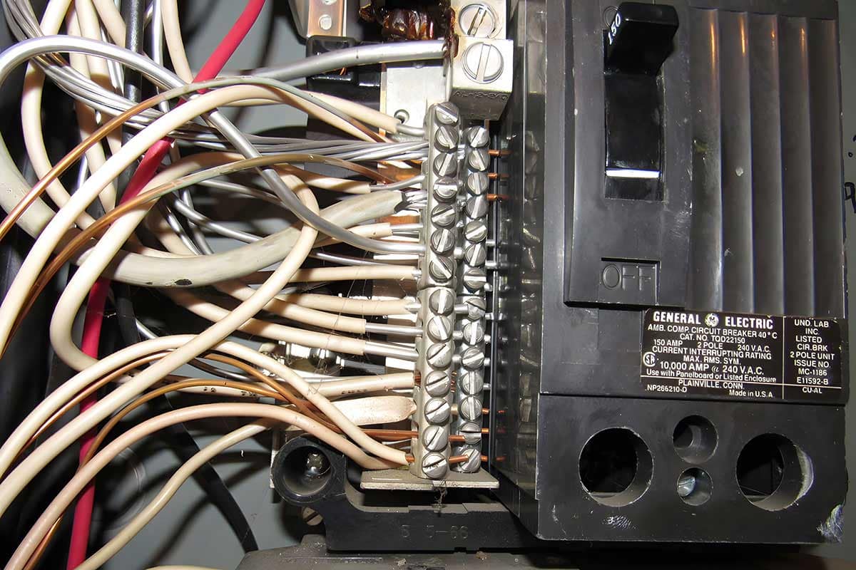 Close-up of an electrical panel with mixed wiring, illustrating what aluminum wiring may look like in older BC condos.