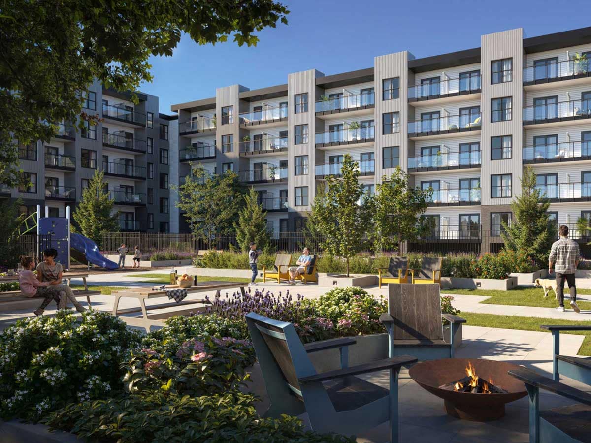 Landscaped courtyard at Langley presale condos with seating areas, fire pit, and playground, illustrating community-focused amenities in new construction homes.